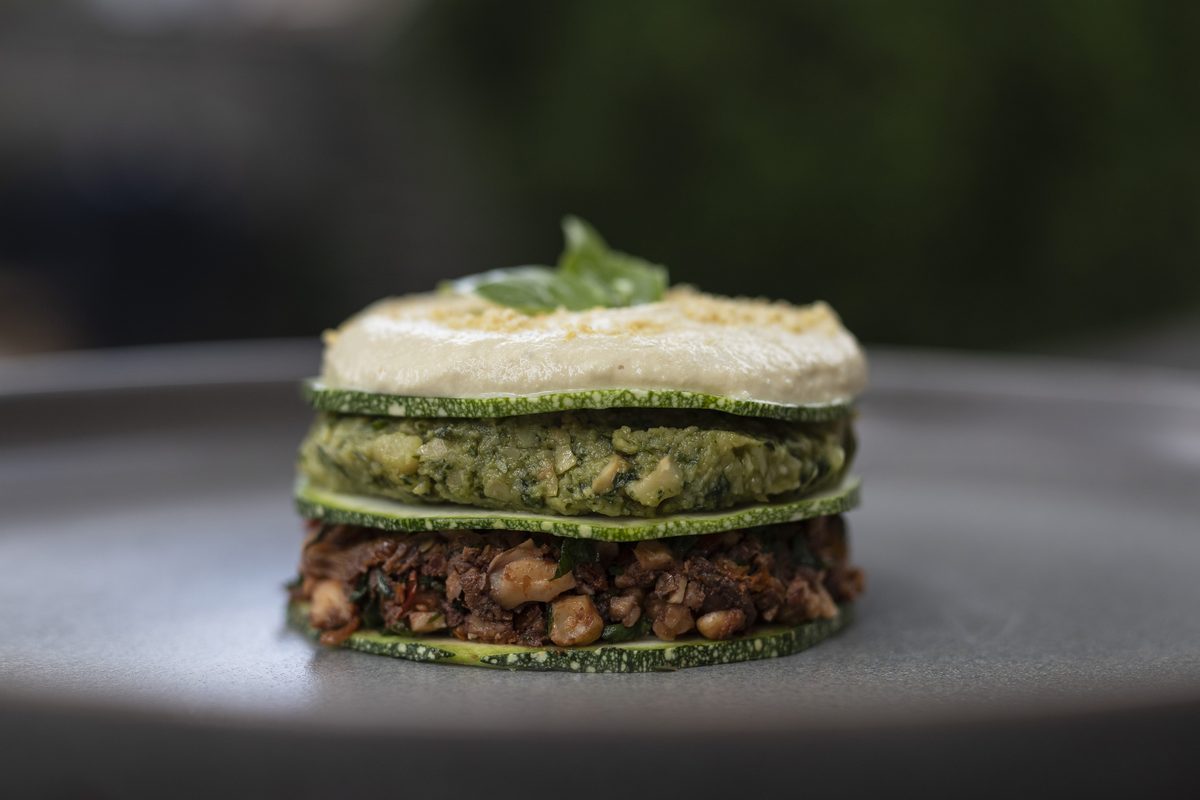 A stacked courgette and lentil dish