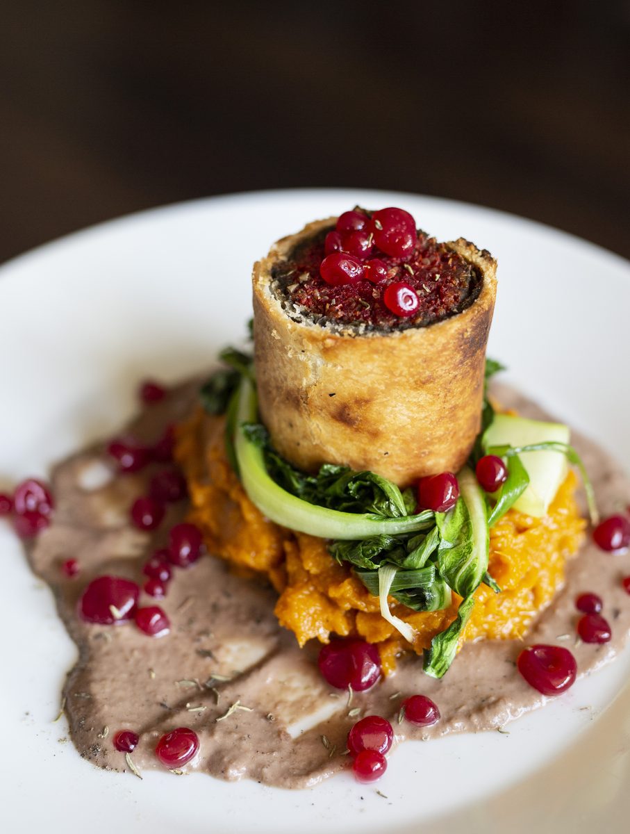 A plated wellington with pomegranate
